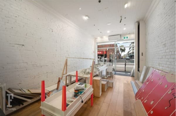 Shop with bare brick walls before work