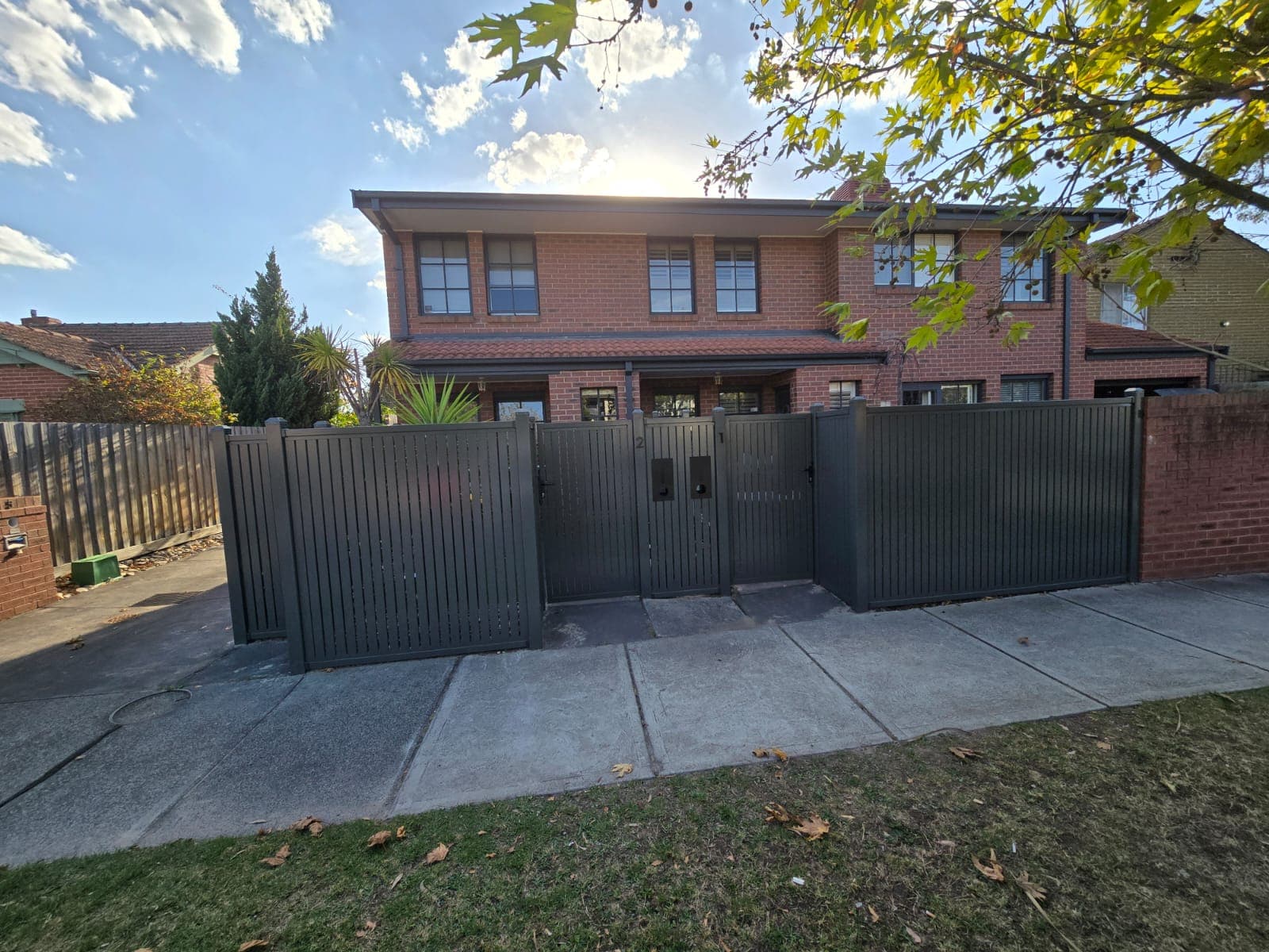 Dark aluminium front fence and gates