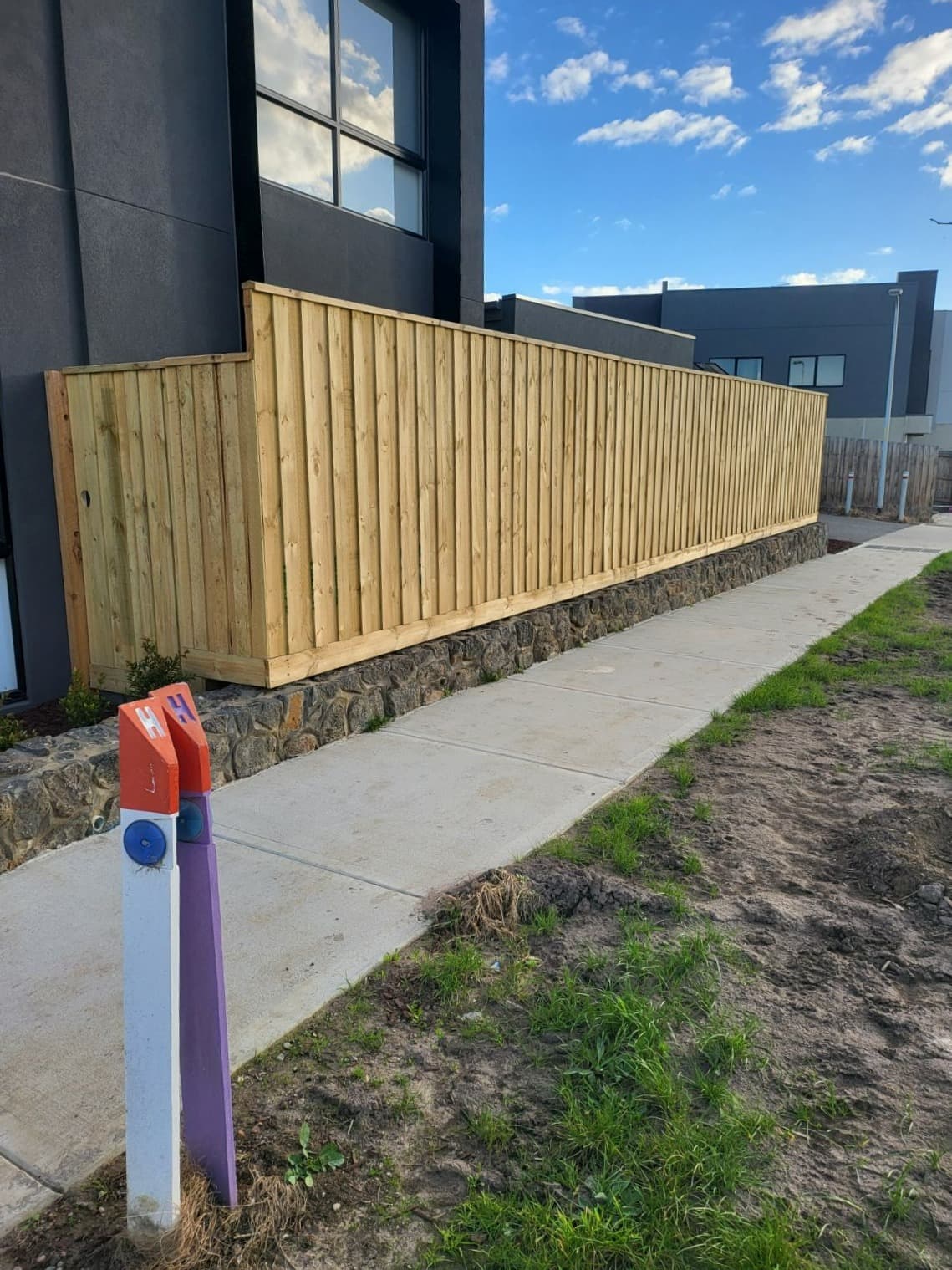 New timber paling fence on a bluestone base