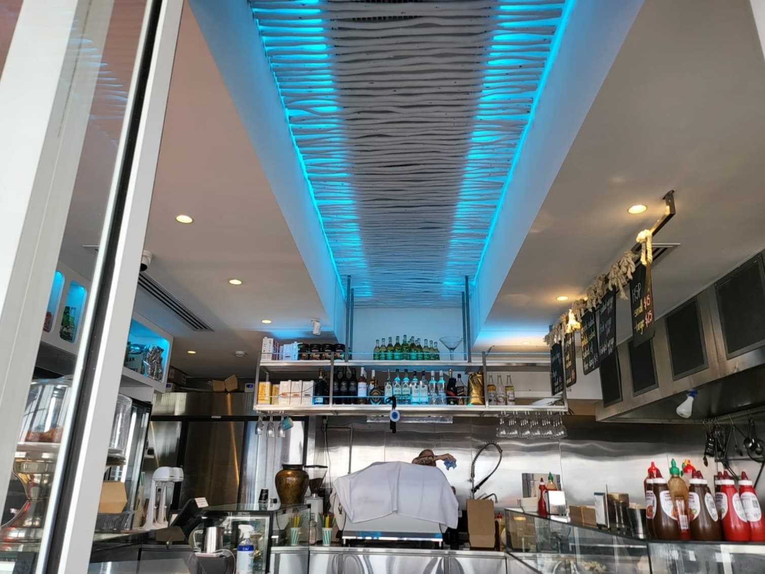 Finished plaster ceiling with blue feature lighting